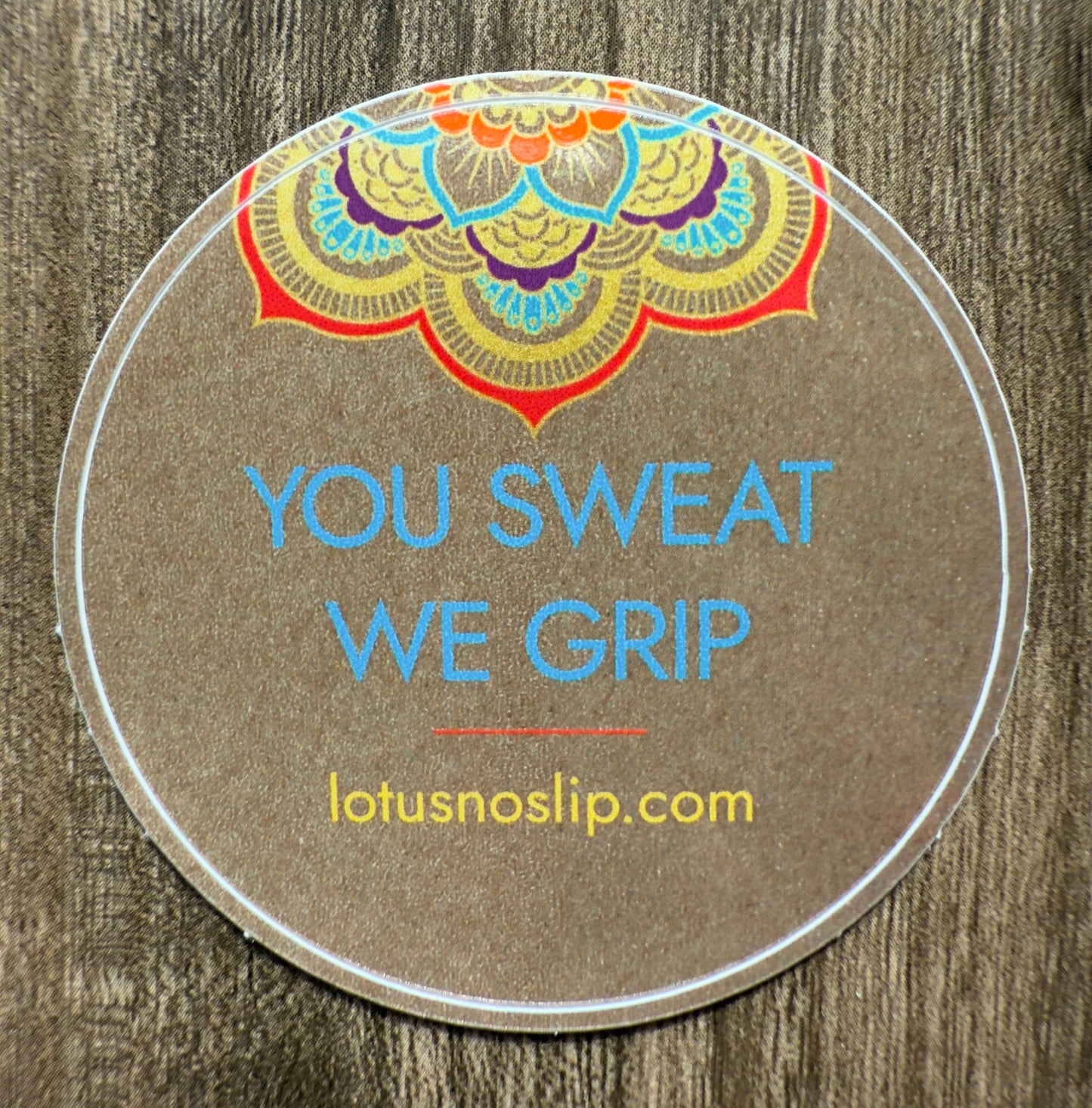 2-inch glossy circular Lotus NoSlip sticker with “You Sweat. We Grip.” slogan – durable and water-resistant yoga decal for personal items and gear.