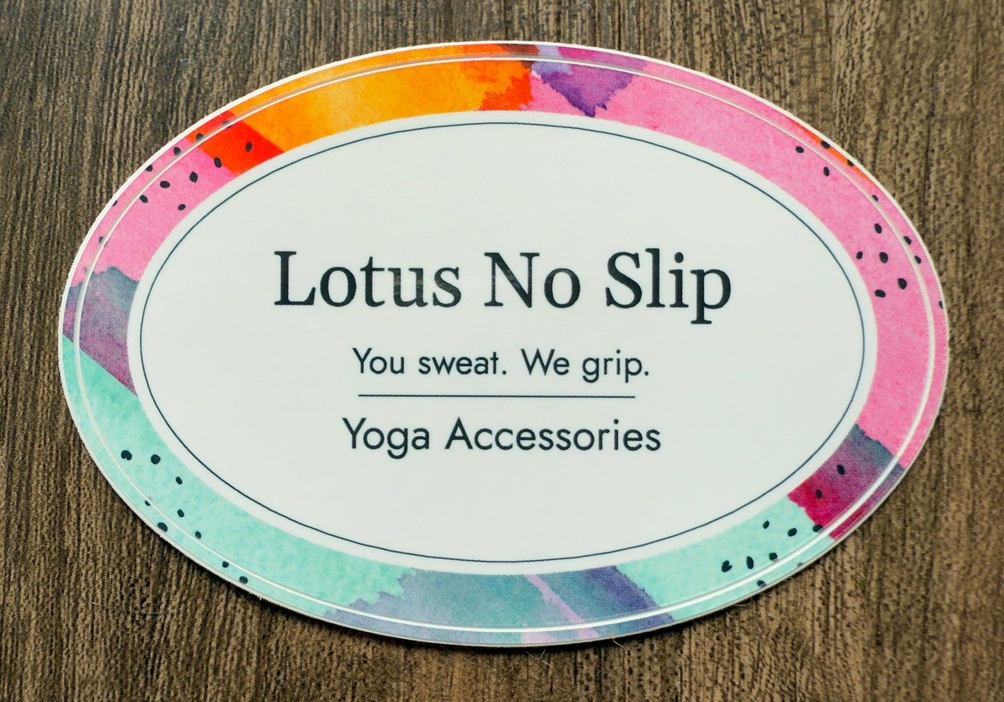 Glossy 2x3" oval Lotus NoSlip sticker with "You Sweat. We Grip." yoga slogan – water-resistant decal for bottles, laptops, and gear.